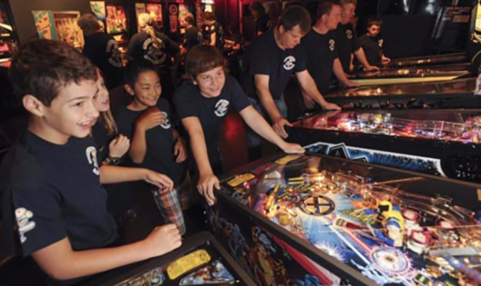 kids playing pinball