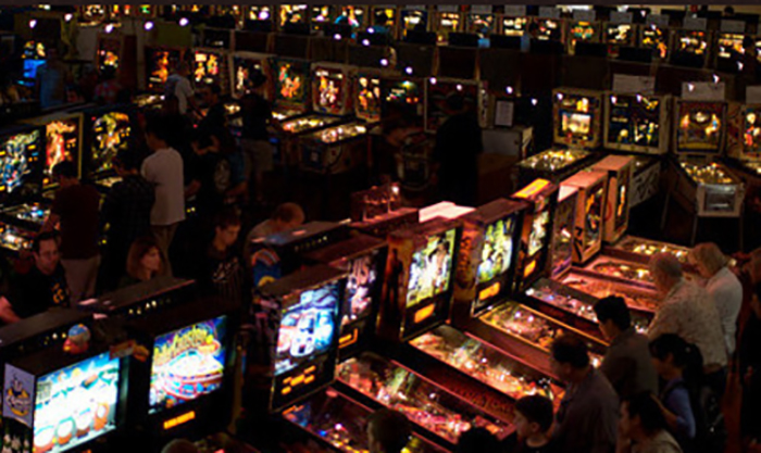 people playing pinball